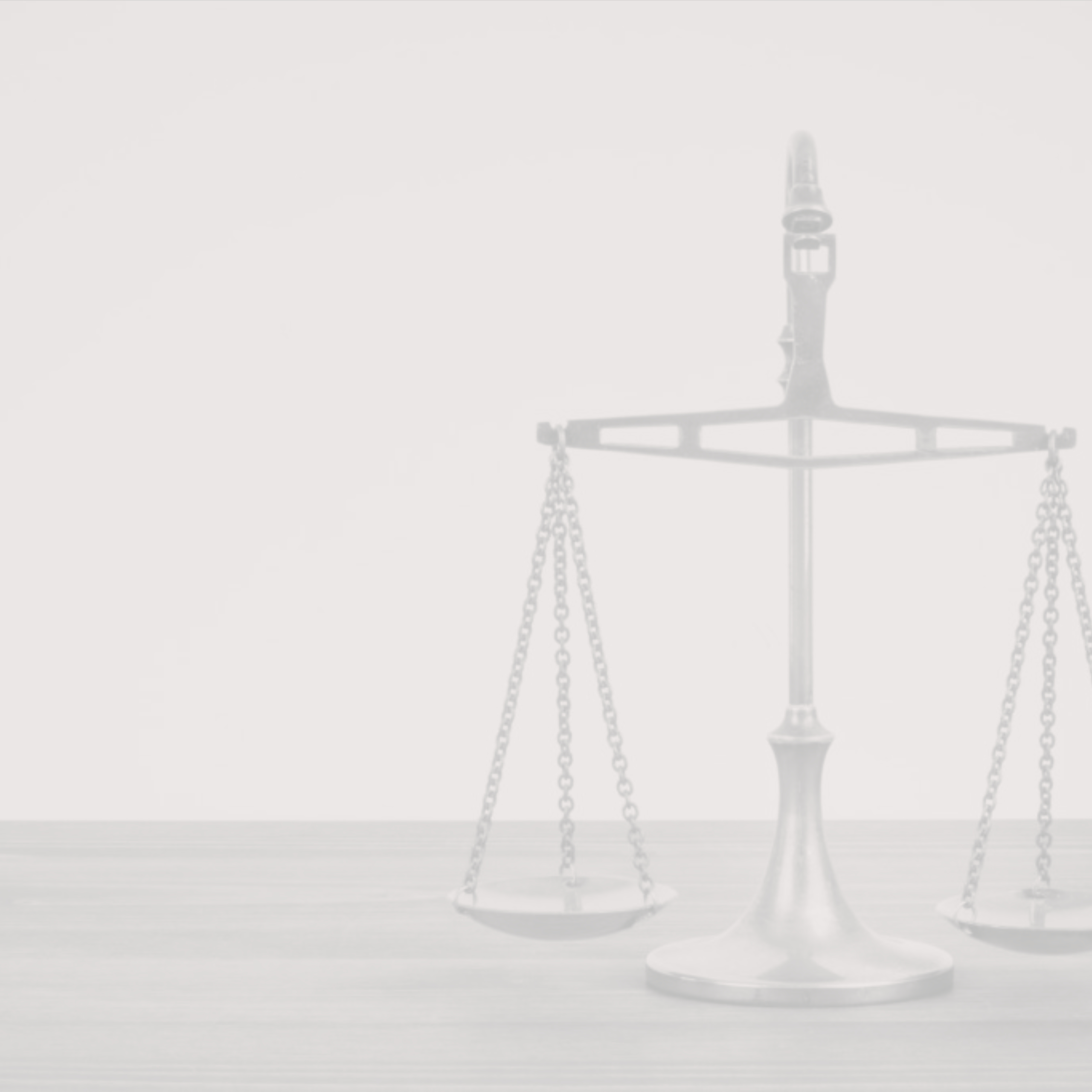 Faded, pale image of a balance scale on a wooden surface against a light background, muted grey tones, calm mood.